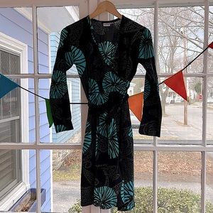 Cotton jersey wrap dress. Print has black, turquoise, gray.